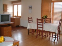 Apartment living room - dining table and kitchen